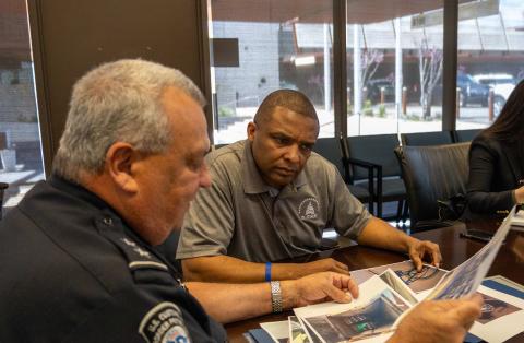 Congressman Don Davis receiving a briefing from Nogales Port Director Michael Humphries