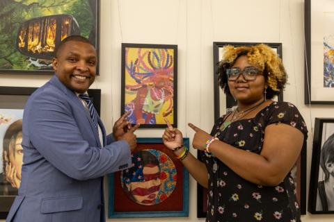 Congressman Don Davis poses with Congressional Art Competition Winner